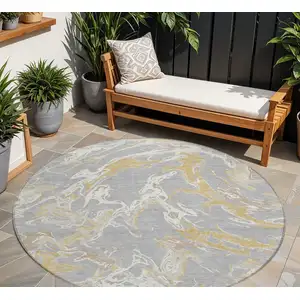 Photo of 8' Gray Ivory And Gold Round Abstract Washable Indoor Outdoor Area Rug