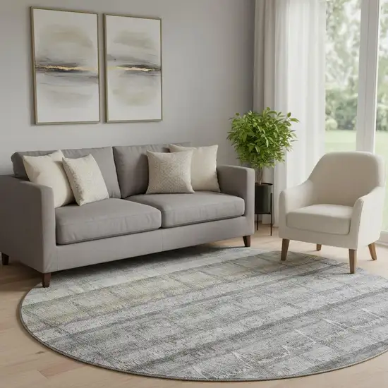 8' Gray Ivory And Gold Striped Washable Round Rug With UV Protection Photo 1