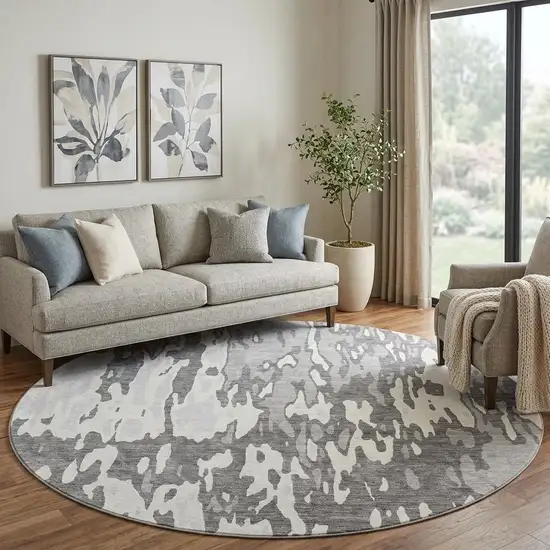 8' Gray Ivory And Silver Abstract Washable Round Rug With UV Protection Photo 1