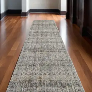Photo of 10' Gray Ivory and Blue Abstract Power Loom Worn Faded Runner Rug With Fringe