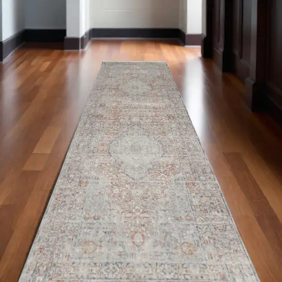 12' Gray Ivory and Orange Oriental Power Loom Worn Faded Runner Rug With Fringe Photo 1