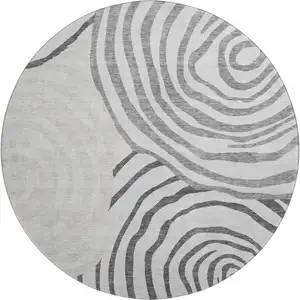Photo of 8' Gray Silver And Beige Abstract Washable Round Rug With UV Protection