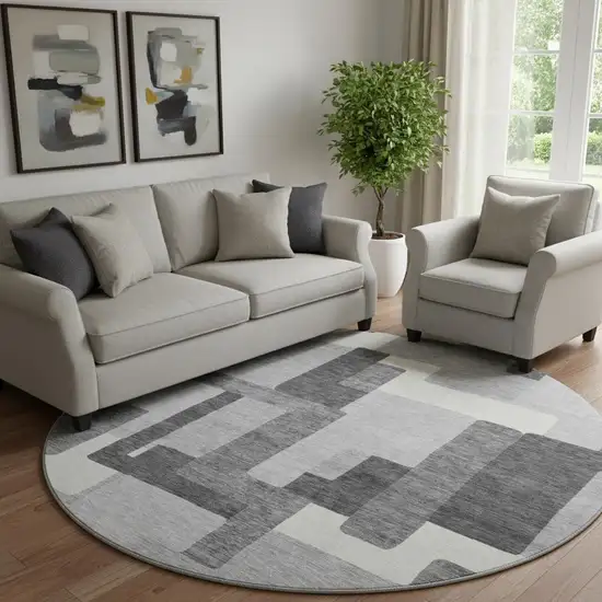 8' Gray Silver And Ivory Abstract Geometric Washable Round Rug With UV Protection Photo 1