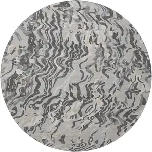 Photo of 8' Gray Silver And Ivory Abstract Washable Round Rug With UV Protection