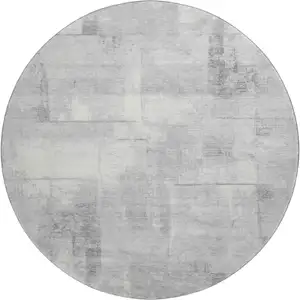 Photo of 8' Gray Silver And Ivory Geometric Washable Round Rug With UV Protection