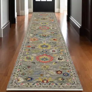 Photo of 12' Gray Yellow And Blue Oriental Runner Rug With Fringe