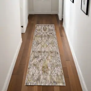 Photo of 8' Gray Yellow and Ivory Floral Power Loom Worn Faded Runner Rug