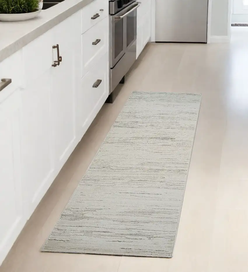 8' Gray and Beige Geometric Distressed Area Rug Photo 1