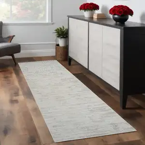 Photo of 8' Gray and Beige Geometric Distressed Area Rug