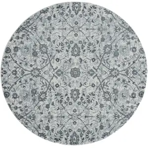 Photo of 6' Gray and Beige Round Floral Power Loom Area Rug