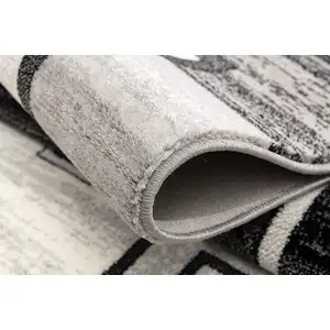 Photo of 8' Gray and Black Geometric Power Loom Distressed Runner Rug