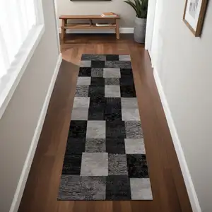 Photo of 8' Gray and Black Geometric Power Loom Distressed Runner Rug