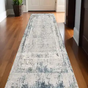 Photo of 13' Gray and Ivory Abstract Distressed Runner Rug