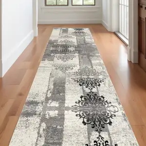 Photo of 20' Gray and Ivory Distressed Damask Runner Rug