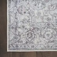 Photo of 8' Gray and Ivory Floral Power Loom Distressed Washable Runner Rug