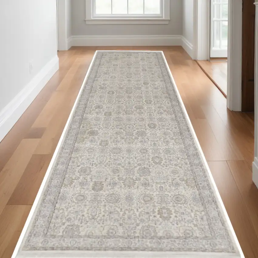 12' Gray and Ivory Oriental Power Loom Worn Faded Runner Rug With Fringe Photo 1