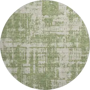 Photo of 8' Green And Beige Abstract Washable Round Rug With UV Protection