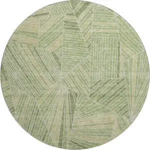 Photo of 8' Green And Beige Geometric Washable Round Rug With UV Protection
