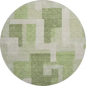 Photo of 8' Green And Beige Geometric Washable Round Rug With UV Protection