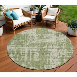 Photo of 8' Green And Beige Round Abstract Washable Indoor Outdoor Area Rug