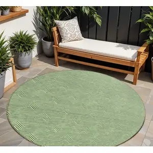 Photo of 8' Green And Beige Round Geometric Washable Indoor Outdoor Area Rug