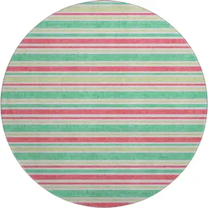 Photo of 8' Green And Blush Striped Washable Round Rug With UV Protection