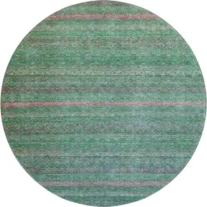 Photo of 8' Green And Blush Striped Washable Round Rug With UV Protection