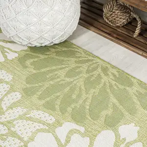 Photo of 10' Green And Cream Floral Indoor Outdoor Runner Rug