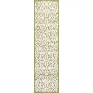 Photo of 10' Green And Cream Geometric Indoor Outdoor Runner Rug
