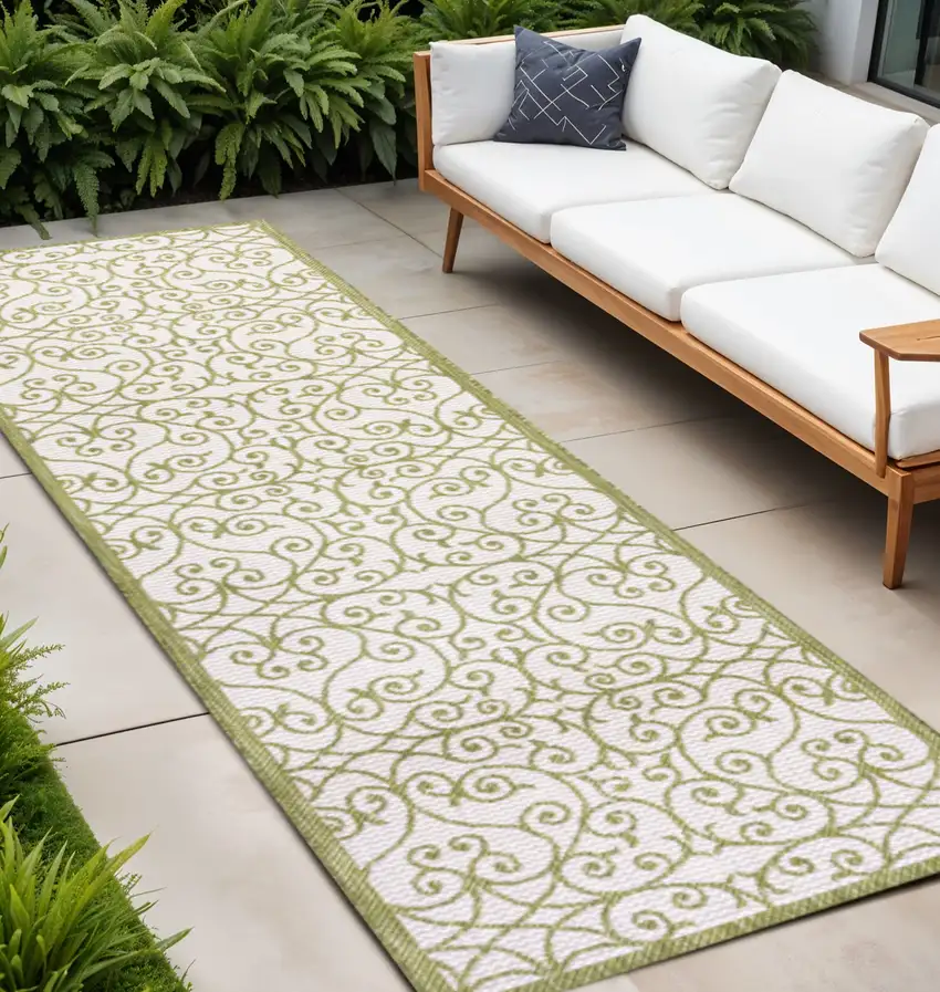 10' Green And Cream Geometric Indoor Outdoor Runner Rug Photo 1