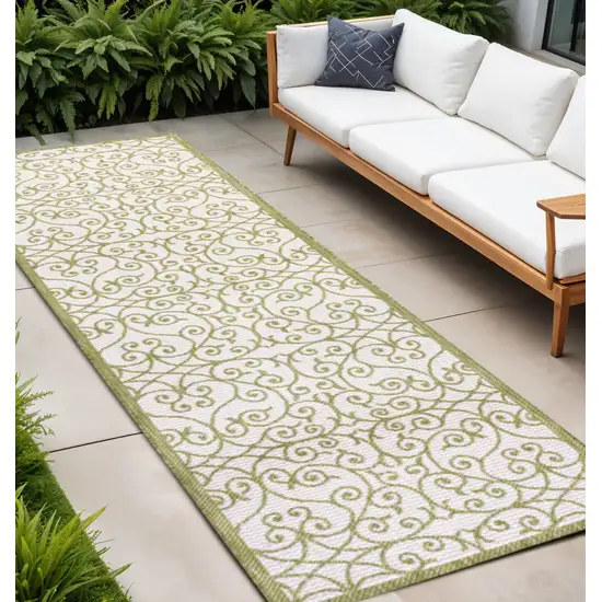 10' Green And Cream Geometric Indoor Outdoor Runner Rug Photo 1