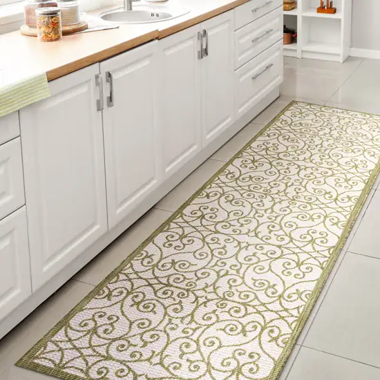 8' Green And Cream Geometric Indoor Outdoor Runner Rug Photo 6