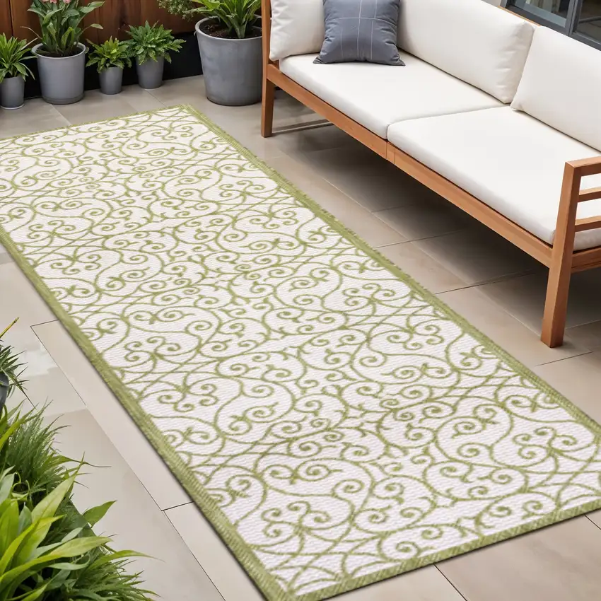 8' Green And Cream Geometric Indoor Outdoor Runner Rug Photo 1