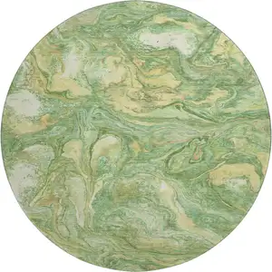 Photo of 8' Green And Gold Abstract Washable Round Rug With UV Protection