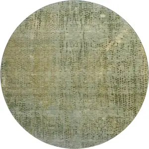 Photo of 8' Green And Gold Abstract Washable Round Rug With UV Protection