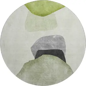 Photo of 8' Green And Gray Abstract Washable Round Rug With UV Protection
