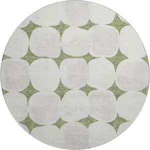 Photo of 8' Green And Ivory Abstract Geometric Washable Round Rug With UV Protection