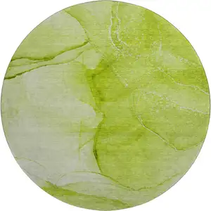 Photo of 8' Green And Ivory Abstract Washable Round Rug With UV Protection