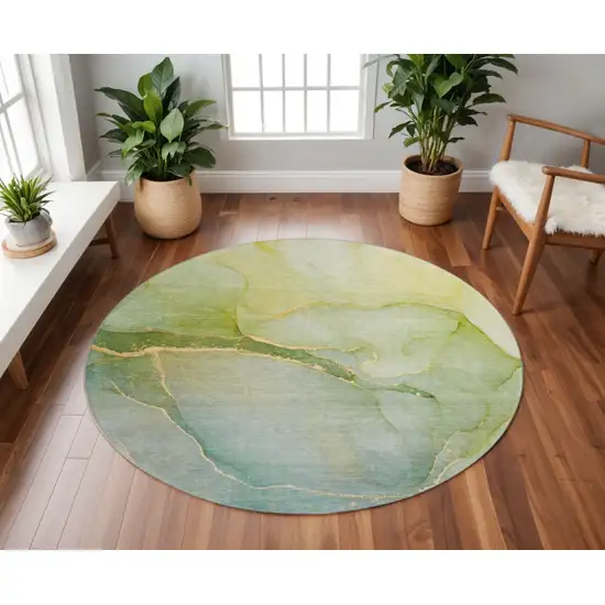 8' Green And Ivory Abstract Washable Round Rug With UV Protection Photo 2