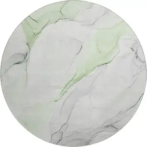 Photo of 8' Green And Ivory Abstract Washable Round Rug With UV Protection