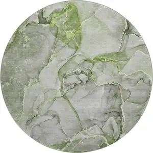 Photo of 8' Green And Ivory Abstract Washable Round Rug With UV Protection