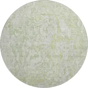 Photo of 8' Green And Ivory Abstract Washable Round Rug With UV Protection