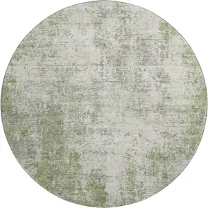 Photo of 8' Green And Ivory Abstract Washable Round Rug With UV Protection