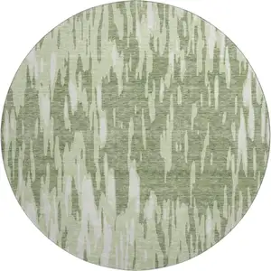 Photo of 8' Green And Ivory Abstract Washable Round Rug With UV Protection
