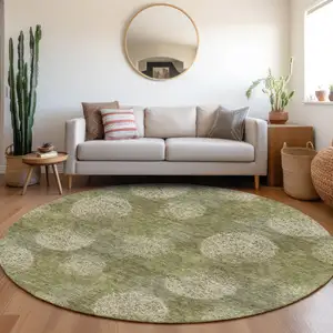 Photo of 8' Green And Ivory Abstract Washable Round Rug With UV Protection