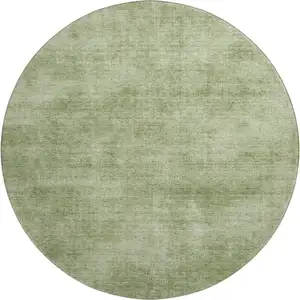 Photo of 8' Green And Ivory Abstract Washable Round Rug With UV Protection