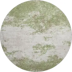 Photo of 8' Green And Ivory Abstract Washable Round Rug With UV Protection