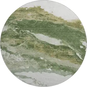 Photo of 8' Green And Ivory Abstract Washable Round Rug With UV Protection