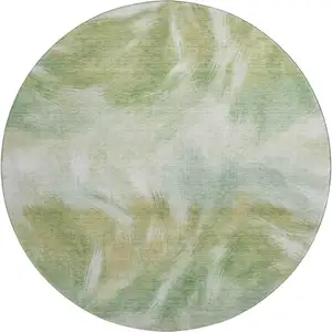 Photo of 8' Green And Ivory Abstract Washable Round Rug With UV Protection