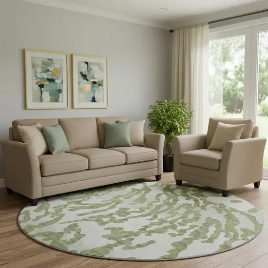 8' Green And Ivory Animal Print Washable Round Rug With UV Protection Photo 1